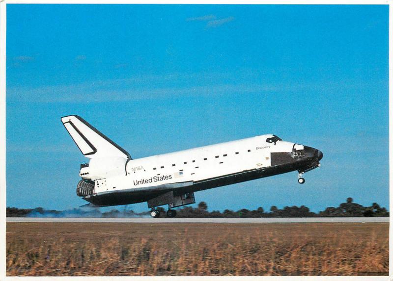 The space shuttle orbiter Discovery makes a precision landing on Kenedy Center