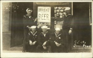 Navy Sailors BEER Sign Jean's Place Postcards on Display Deltiology c1920 RPPC