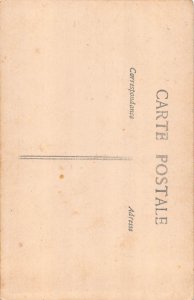 B450 Risque Semi-Nude Beauty posing near Flowers RPPC postcard