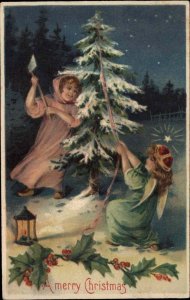 Christmas Little Girls Chopping Down Christmas Tree c1910 Vintage Postcard