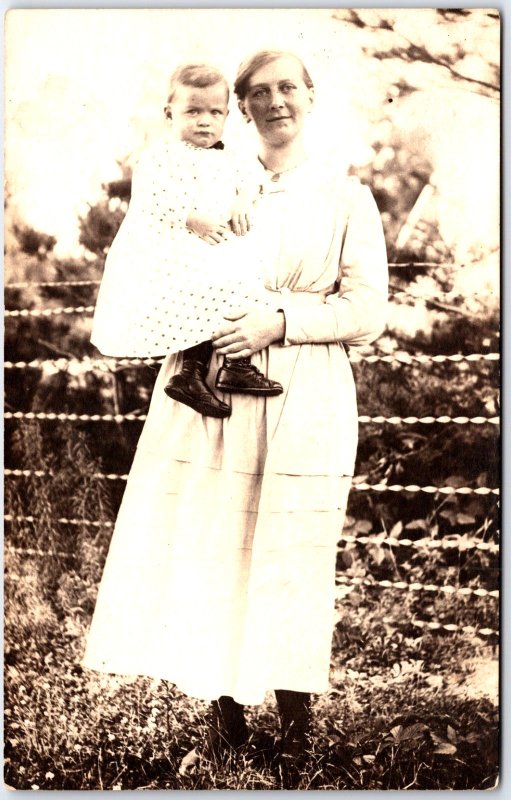Woman in Long Dress, and Infant Child Dotted Dress Portrait - Vintage Postcard