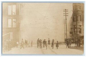 1909 Fire Disaster Smoke Firemen Crowd Street Manistee MI RPPC Photo Postcard