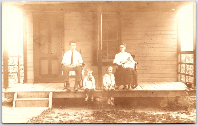 Man and Woman with Children and Infant Child Porch Portrait - Vintage Postcard