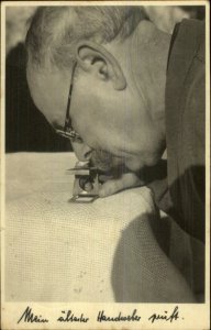 Labor Occupation Tailor? Man Examines Fabric Under Magnifying Glass RPPC