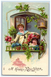 New Year Postcard Children On Window With Flowers Bird Cage Embossed c1910's