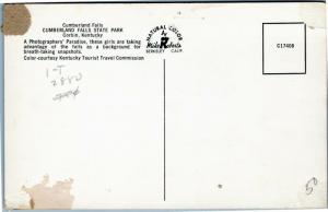 Women taking photos by waterfall, Cumberland Falls State Park Kentucky