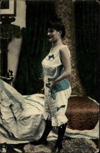 Risque Beautiful Woman Putting on Corset Vintage Fashion c1910 Postcard