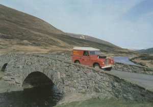 Royal Mail Van & Postman Travelling To Braemar Scottish Postcard