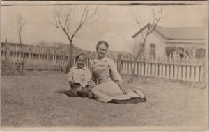 RPPC Mother Young Boy Seated on Lawn Leafless Trees Picket Fence Postcard X2