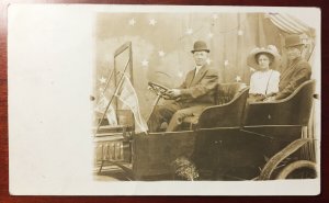 Woman & Two Men in Automobile Portrait at Exhibition Real Photo Postcard G63