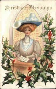 Christmas Beautiful Woman in Church Hymnal Bible c1910 Vintage Postcard