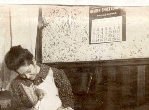 1908 RPPC WARREN-EHRET CO CALENDAR ON WALL*WOMAN & INFANT*BABY*FLORENCE YODER 