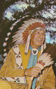 Indian Chief In Colorful Headgear At Powwow Of The Omaha and Winnebago Tribes...