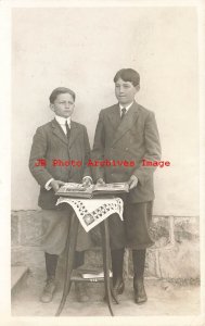 Unknown Location, RPPC, Two Boys Looking at a Postcard Album, Photo 