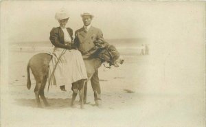 Beach Donkey Couple C-1910 RPPC Photo Postcard 20-4944