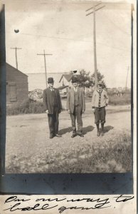 RPPC Men and Boy Headed to Ball Game Dirt Road Wagons in Distance Postcard U6