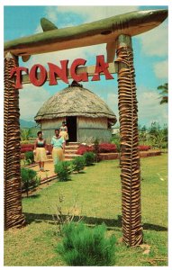 Two Tonga Villagers walk path from replica Queens Hut Hawaii Postcard