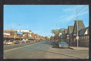 GAYLORD MICHIGAN DOWNTOWN STREET SCENE OLD CARS STORES VINTAGE POSTCARD