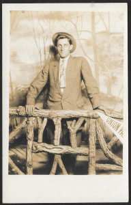 Man in Suit & Hat at Wooden Fence RPPC Unused c1910s