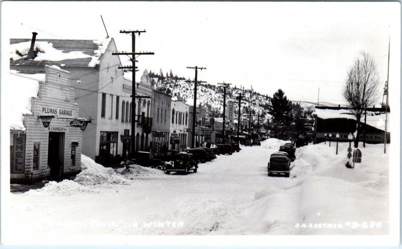 RPPC QUINCY, CA California  STREET SCENE in Snow FORD Sign c1940s Cars Eastman