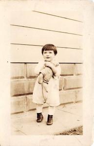 Child with a toy Child, People Photo Writing on back 