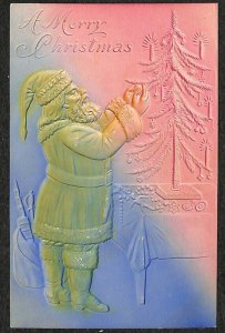 1909 Merry Christmas Green Suited Santa Claus Trimming The Tree Emboss Postcard