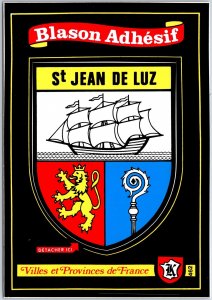 VINTAGE CONTINENTAL SIZED POSTCARD (ADHESIVE) COAT OF ARMS ST JEAN DE LUZ FRANCE