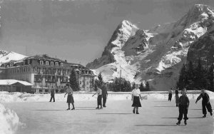 Ice Skating Rink People Palace Hotel Alps Eiger Switzerland Real Photo postcard