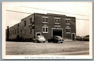 Postcard RPPC c1940s Delhi Ontario District German Home Ltd. Coca Cola Sign Cars