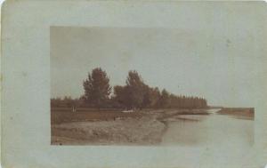 Vintage real photo postcard to identify river valley landscape 