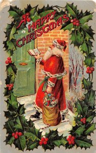 F39/ Santa Claus Merry Christmas Postcard c1910 Holly Border Door Toys 17