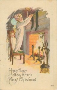 Boy Hanging Stocking by Fireplace 1923 Christmas Postcard