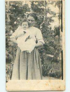 pre-1920's rppc BABY PLAYS WITH 2 SMALL OBJECTS IN HANDS - postcard v1347