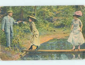 Divided-back PEOPLE WALKING ACROSS PLANK BRIDGE Postmarked Muncie IN AD8060