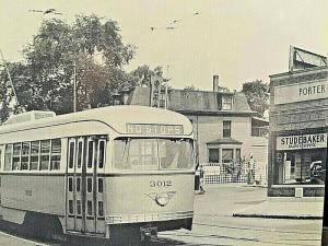 Postcard Reprinted Non-Stop Trolley Bus passing Studebaker Service  Store, TX W9