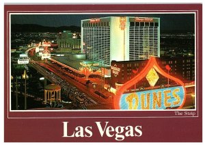 The Strip at Night Las Vegas Dunes Barbary Coast Flamingo Hotel Postcard