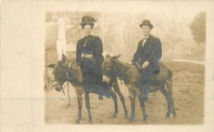 Postcard RPPC C-1910 Couple Donkey's big hat woman 23-1961