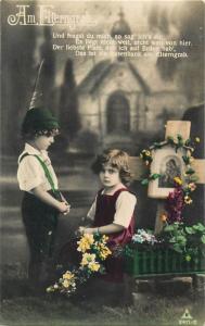 Old tinted real photo postcard children pray at the parents grave Am Elterngrab