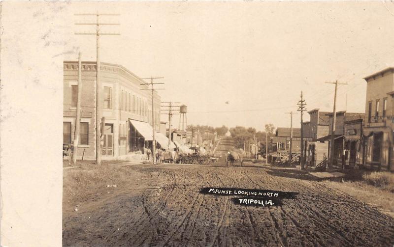 F1/ Tripoli Iowa Real Photo RPPC Postcard c1910 Main St Wagon Stores