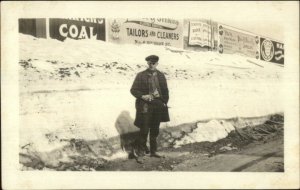 Man in Front Advertising Signs on Fence Amsterdam NY on Back c1920 RPPC #2