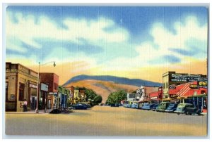 c1940 Main Street Business District Rattlesnake Mountain Cody Wyoming Postcard