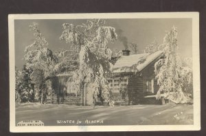 RPPC WINTER IN ALASKA SNOW LOG CABIN VERN BRECKLEY REAL PHOTO POSTCARD