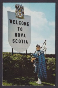 Postcard, Canada, Welcome to Nova Scotia Man in Scottish Tartan playing Bagpipes