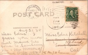 RPPC Man on House Porch, Woman in Garden, Girl with a Bicycle in Front Yard