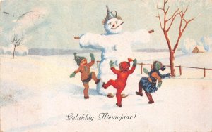 CHILDREN DANCING SNOWMAN HAPPY NEW YEAR HOLIDAY NETHERLANDS POSTCARD 1923