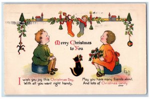 1910 Christmas Boy Girl Stockings Full Of Toys Black Cat Holly Candle Postcard