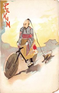 PEKING CHINA MAN ON BICYCLE AND DOG POSTCARD (c. 1900)