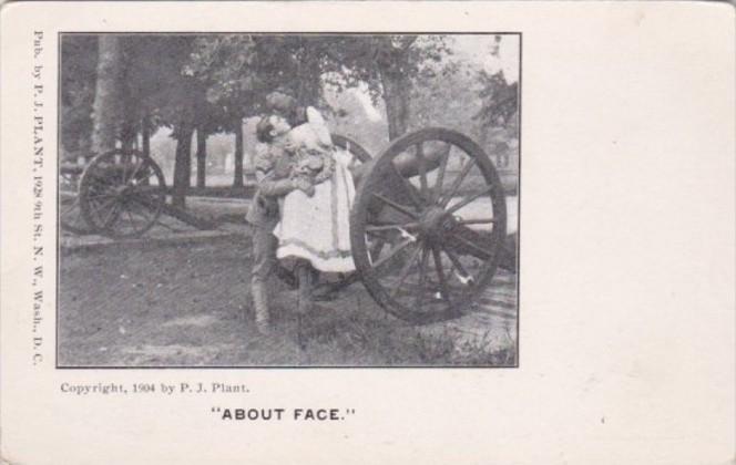 Military Romantic Couple Sitting On Canon About Face