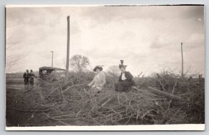 RPPC Edwardian Ladies Women Posing Pile of Tree Branches Postcard B30