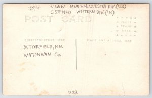 Butterfield MN Folk Stand on Tipped Train Engine After Wreck~Winter RPPC 1/1911